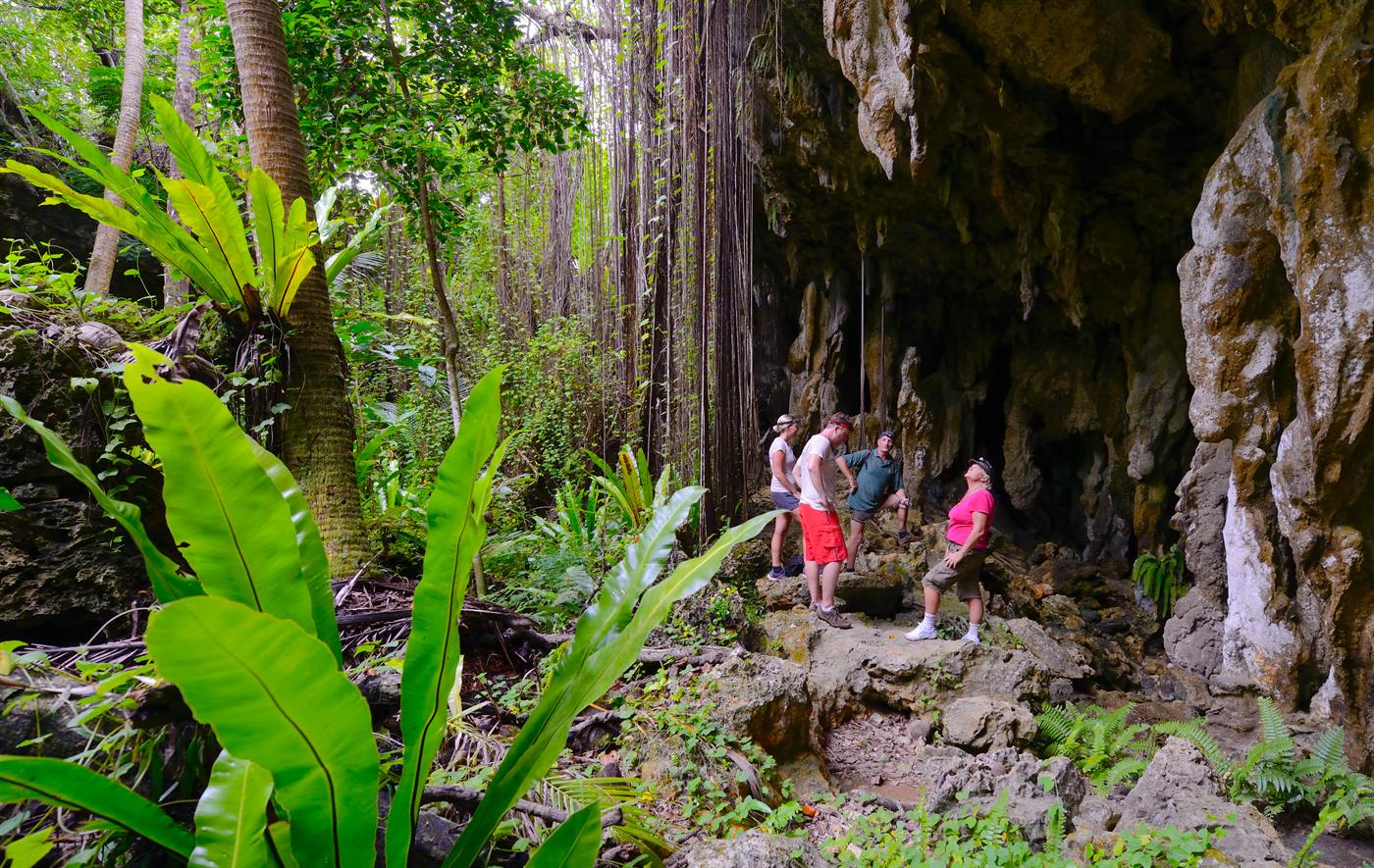 Visitors at the jungle entrance to Anatakitaki Cave on Enuamanu (Atiu)