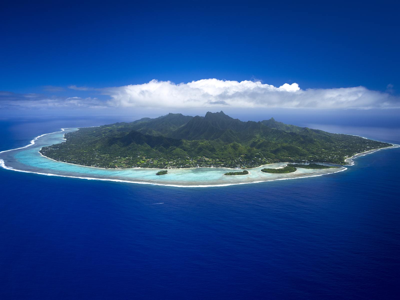 Rarotonga from the air surrounded by reef